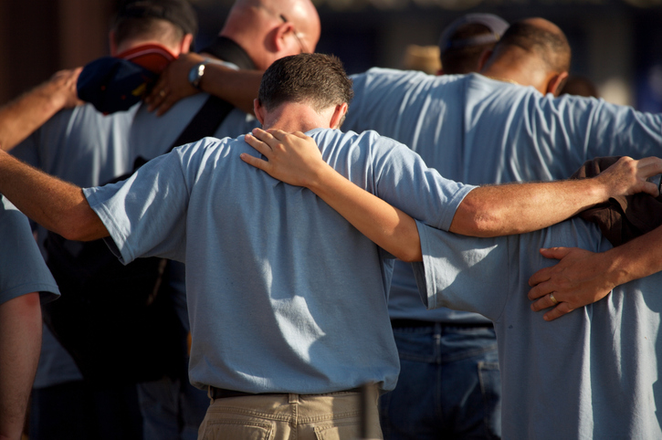 US Capitol City photo scenes men gathered in prayer